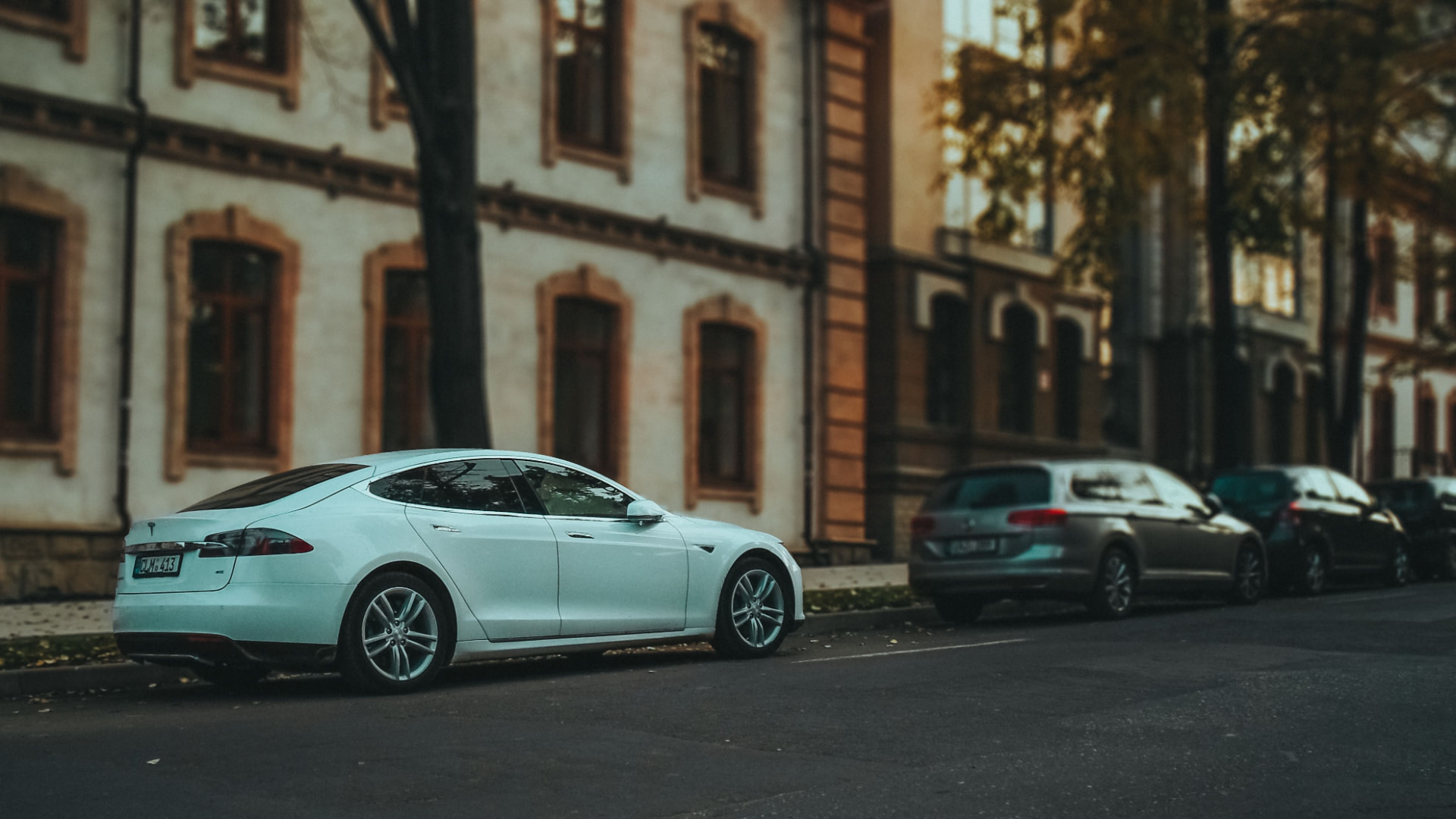 Plug-in hybrid with a Hungarian green license plate overlooking Budapest